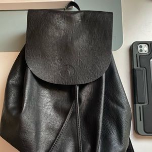 Black faux leather bolo backpack